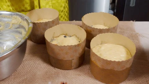 Close-up of the process of cooking delicious Easter cakes with raisins and Stock Footage 153351236