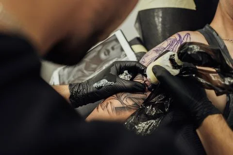 Close Up of Process of Creating Tattoo Art, Artist Draws on the Clients Skin Stock Photos