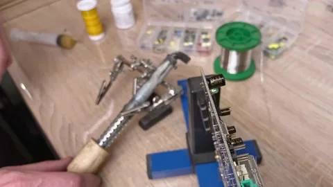 Close-up of the process of desoldering a computer board. Workflow in the work 스톡 동영상 130779779