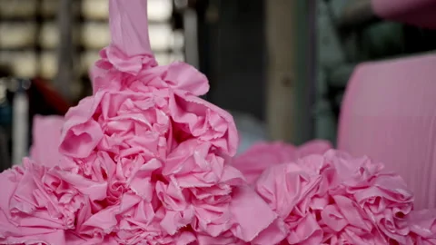 Close-up of the process of dyeing fabric pink. VietNam Cloth Dyeing Factory Video stock 247404762