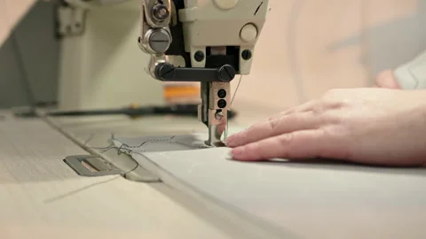 Close up process of embroidering diamond pattern on cowhide in atelier on step Stock Footage 176344553