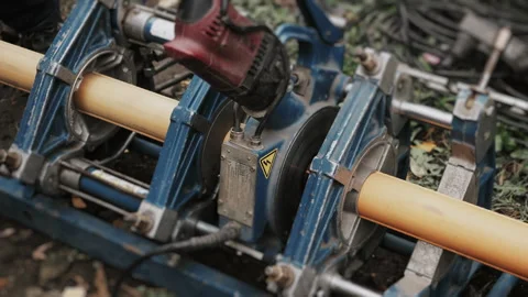 Close-up of the process of facing a plastic gas pipe for welding. 스톡 동영상 318270174