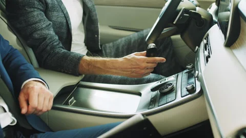 Close up of the process of handing over the key to a new car against the Stock Footage 240497156