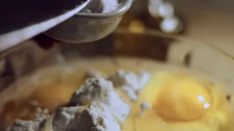 Close up process of handmade dough from flour. Adding salt the pile of white Stock Footage 144820196
