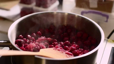 Close up. Process in the kitchen, caramelization of cherries. Stock Footage 233296792