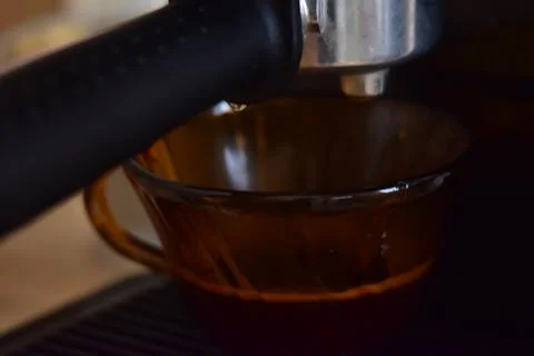 Close up of process of making espresso coffee on a coffee machine Stock Photos