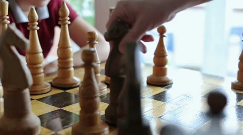 Close-up process of playing chess. Black knight moving and taking white pawn Stock Footage 47630947