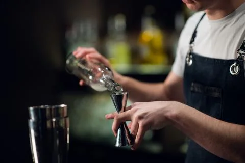 Close-up of the process of preparing a cocktail with liqueur at a party of Stock Photos