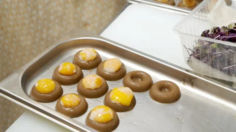 Close-up of the process of preparing snacks with egg yolk. Fusion or molecular Stock Footage 150968145