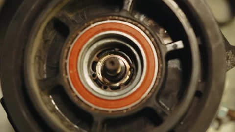 Close-up process of putting a bearing on a part Stock Footage 285641716