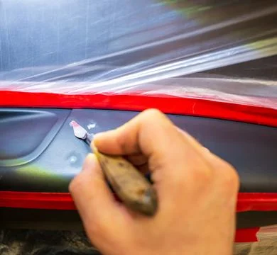 A close-up of the process of restoring the leather of the interior. Stock Photos