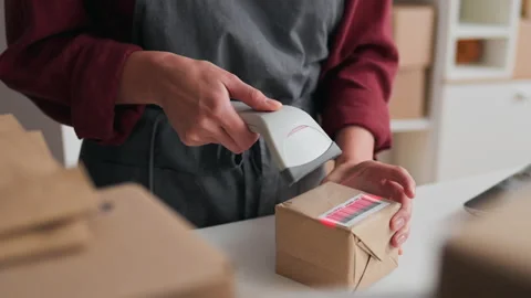 Close-up of the process of scanning a box with a barcode of packed parcels, 스톡 동영상 229740821