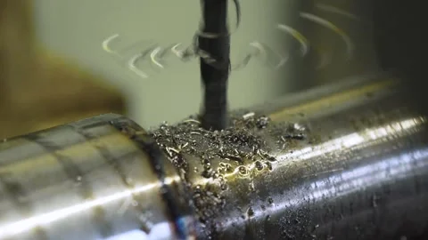 Close-up of process of vertical drilling with flying shavings, slow motion 스톡 동영상 143554407