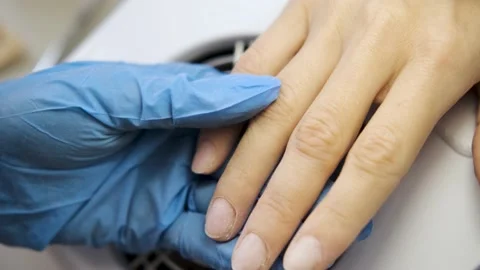 Close-up. processing nails with a milling cutter. nail care. Stock Footage 229880955