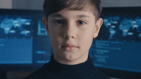 Close-up Prodigy Boy Hacker Programmer at data center filled with monitor Vidéo 102068883