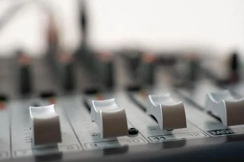 Close-Up of Professional Audio Mixing Console with Control Sliders and Swit.. Stock Photos