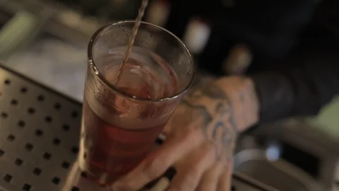 Close Up Of Professional Bartender Stirring Negroni with Bar Spoon Stock Footage 129781467