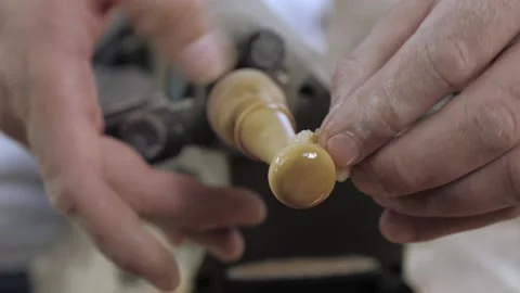 Close-up of a professional carpenter applying linseed oil to a piece of wood  Stock Footage 139446705