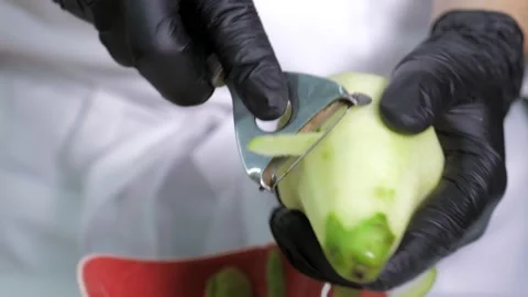 Close-up of a professional chef in black gloves in the kitchen of a restaurant Stock Footage 168967719