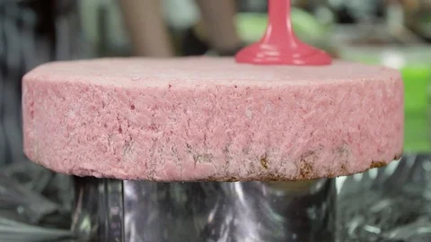 Close-up of professional chef covering the glaze cake. Removal of excess glazing Stock Footage 74716882