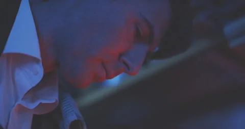 Close up of professional chef in kitchen with blue and red lights Stock Footage 203555793