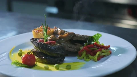 Close-up Professional Chef at Restaurant Kitchen Serves Dish Adding Final Stock Footage 192344714