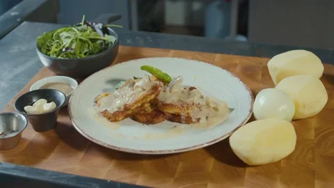 Close-up of Professional Cook Stylishly Serving Crust Golden Potato Pancakes Stock Footage 196259157