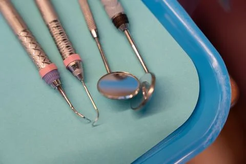 Close up of professional dental picks and mirrors on a tray. Stock Photos
