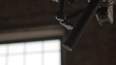 Close up professional directional microphone on boom pole to record sound during Stock Footage 239870913