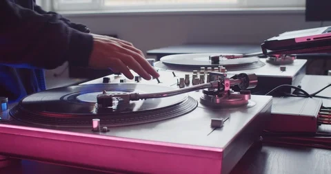 Close-up professional DJ tunring knobs and vinyl record on DJ mixer in studio 스톡 동영상 114336653