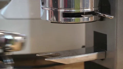 Close-up professional grinding freshly roasted coffee in espresso machine Stock Footage 83466356