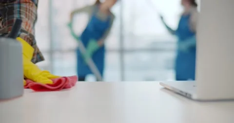 Close up of professional janitor cleaning table in office Stock Footage 147385419