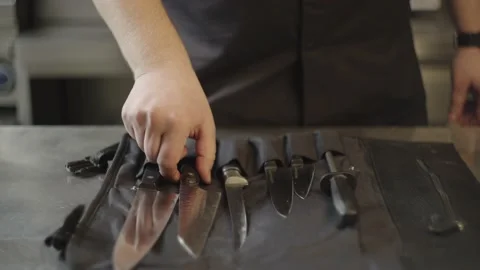 Close-up of professional kitchen knives being taken by the chef. Stock Footage 232617906