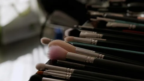 Close up of Professional make up brushes on the table. Move camera Stock Footage 229888440