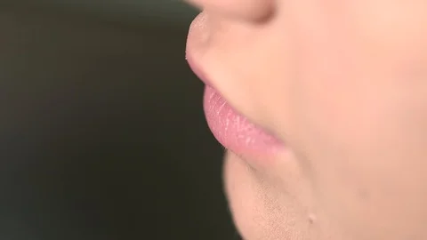 Close-up Of A Professional Makeup Artist Applying Lipstick On Model's Lips Stock Footage 128388548