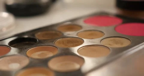Close-up of a professional makeup palette with foundation and blush shades on a Stock Footage 333228085