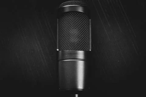 Close-Up of Professional Microphone on Dark Background Stock Photos