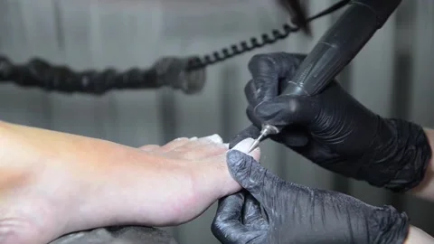 Close Up Professional Pedicure Removing Old Gel Polish with Electric Nail Drill Stock Footage 340820522