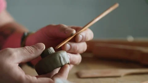Close-up of a professional potter's hands sculpting a clay bowl mold Stock Footage 145544257