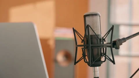 Close up on professional recording microphone and next to laptop computer Video stock 218476177