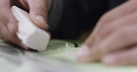Close up of professional surfer using cube of wax and applying it to new board Video stock 158060403