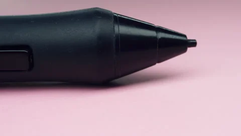 Close up professional tablet pen on pink background.4k macro detail. Stock Footage 155284436