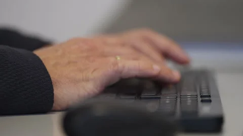 Close-Up of Professional Typing on Computer Keyboard at Workstation Stock Footage 336024968