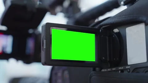 Close up professional video camera with chroma key green screen mockup on flip Stock Footage 337062048