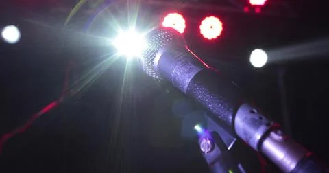Close up of a professional vocal wire microphone on a microphone stand on s.. Stock Photos