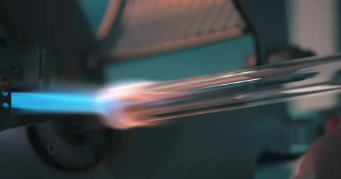 Close up of professional worker using torch melting glass with flame at fibre Stock Footage 135658417