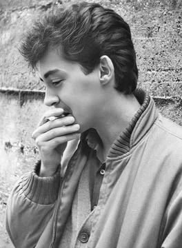 Close-up profile of an 80s boy. Stock Photos
