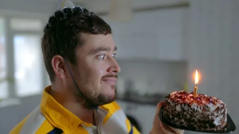 Close Up Profile One Happy Man Blowing Out Burning Birthday Candle 库存影片 334042711