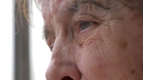Close up profile of pensive elderly woman with eye tremor Stock-Footage 337909653