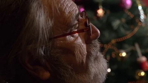 Close-up profile portrait of tired senior man takes off his glasses at dark room Stock Footage 80242736